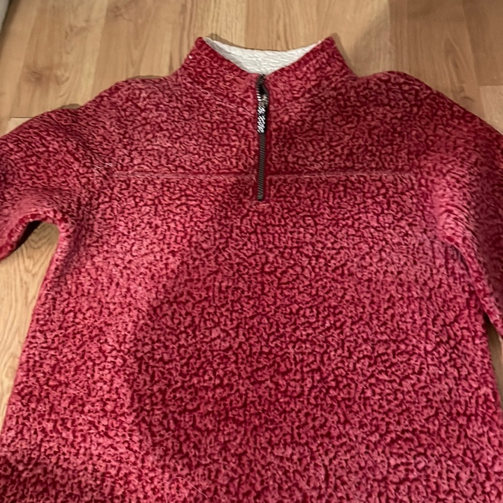 A red half zip sweater, i bought it but never wear it anymore. Good Condition